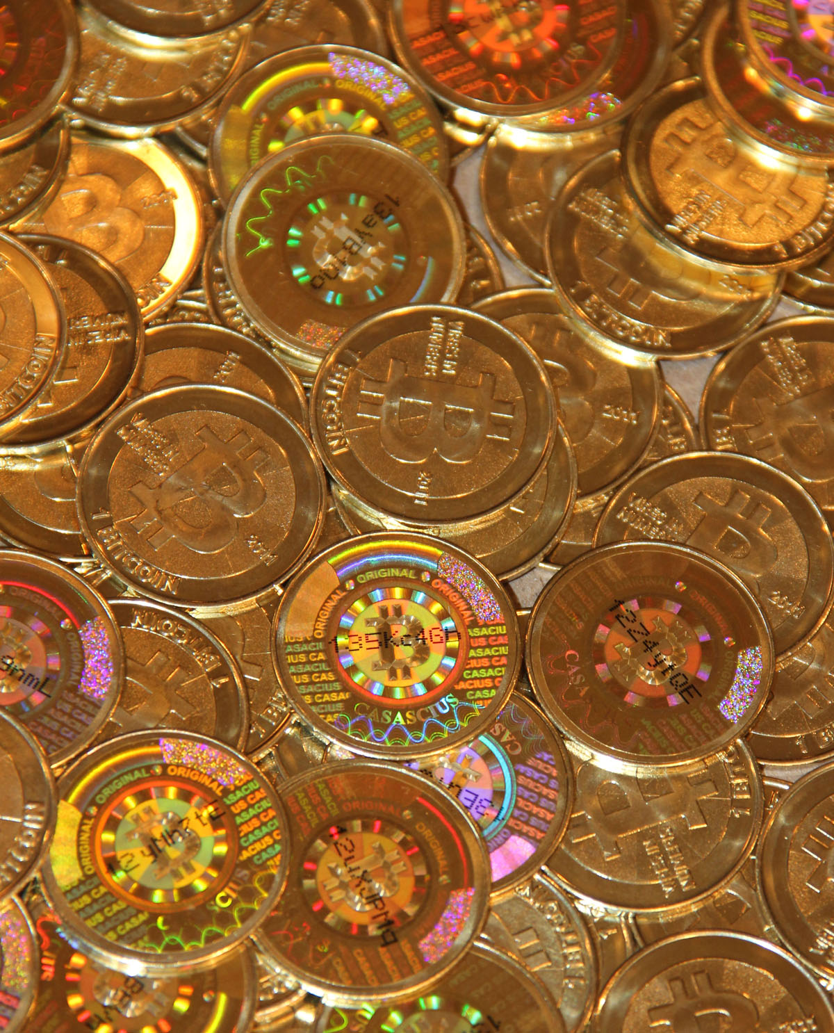 Physical bitcoins with holographic seals